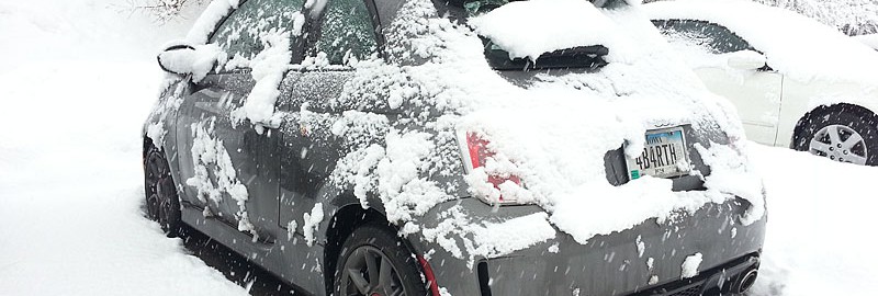 In the parking lot, after already being cleaned off at least once. Still coming down.